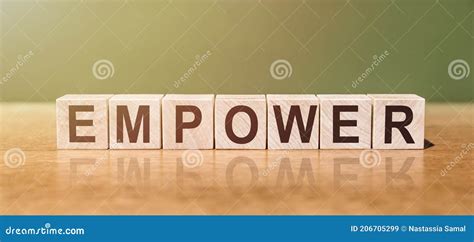 Empower Is Word Written On Wooden Blocks On A Wooden Table Concept For