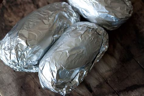 Why bake potatoes in the oven. baked potato in oven wrapped in foil