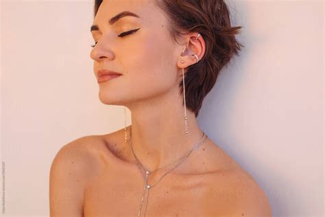 Daydreaming Woman With Silver Jewelry By Stocksy Contributor Liliya Rodnikova Stocksy