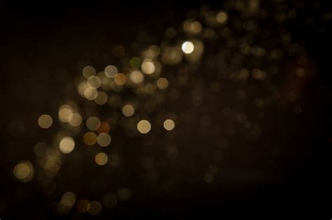 Premium Photo Gold Abstract Bokeh On Black Background