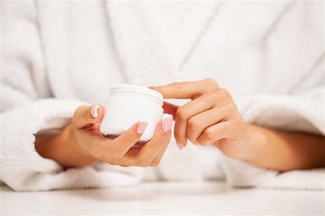 Premium Photo Hand Skin Care Woman Applies Moisturizer On Soft Silky