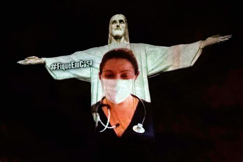 Rios Christ The Redeemer Statue Lit Up As A Doctor As Tribute To