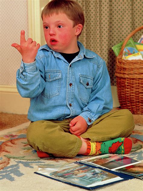 7 Year Old Boy With Downs Syndrome Sign Language Photograph By Hattie