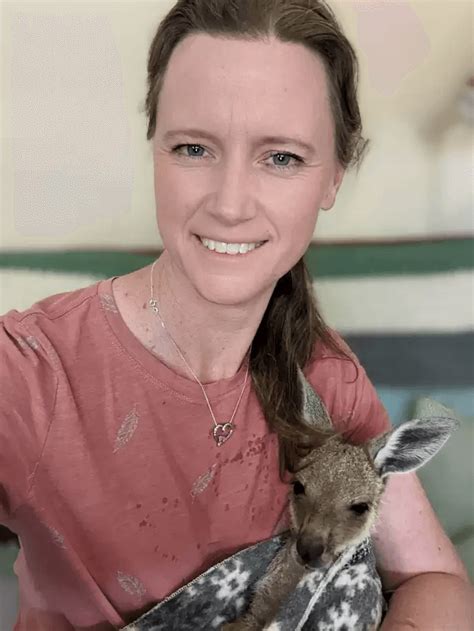 Orphaned Kangaroo Cant Stop Cuddling And Kissing The Woman Who Rescued Him