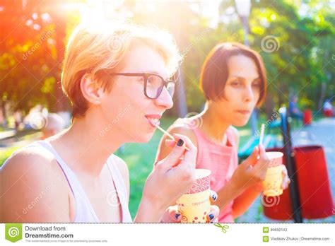 Two Girls Drinking Coffee In The Park Stock Image Image Of Holiday