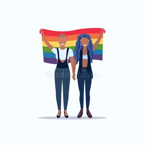 women couple holding rainbow flag love parade lgbt pride festival concept mix race lesbian