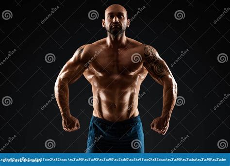 Tattooed Male Bodybuilder Posing Over Black Background Fitness Workout