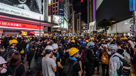 Demonstrators In Hong Kong Dodge Tear Gas In Fast Moving Mass Protests