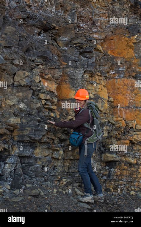 Female Geologist Examining Marcellus Shale Near Marcellus New York