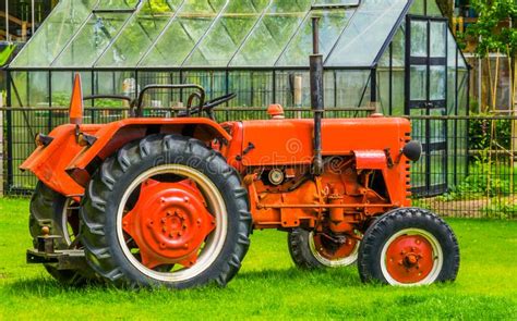 Closeup Of A Red Tractor At The Barn Agricultural Transport And