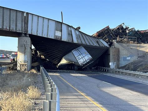 Truck Driver Killed When Train Derails Railroad Bridge Collapses In