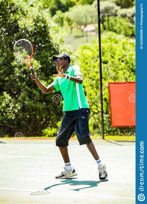 Amateur Black African Male Tennis Player Practicing On A Sunny Day