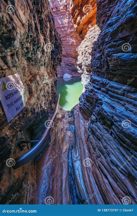 hiking to handrail pool in the weano gorge in karijini national park western australia 35 stock