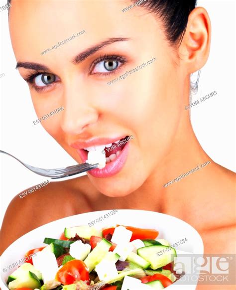 Closeup Portrait Of A Gorgeous Young Girl Eating Vegetable Salad
