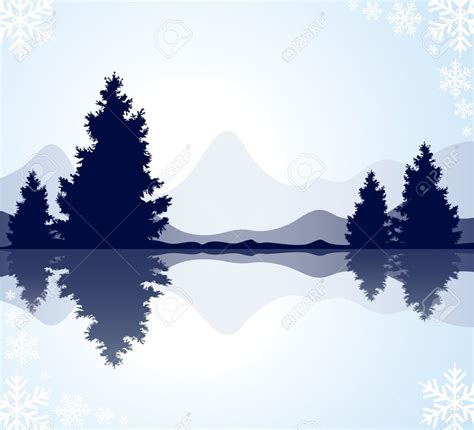 The Silhouette Of Trees And Mountains Reflected In Water With
