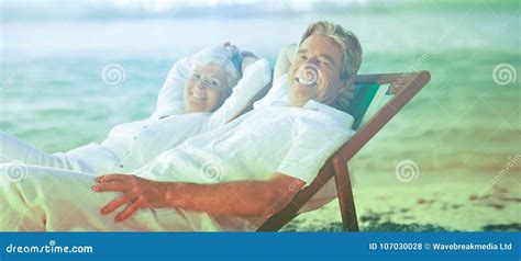 Elderly Couple Relaxing In Their Deck Chairs Stock Photo Image Of