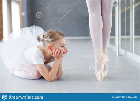 Little Ballerina Is Looking At Professional Ballet Dancer Cute Kid