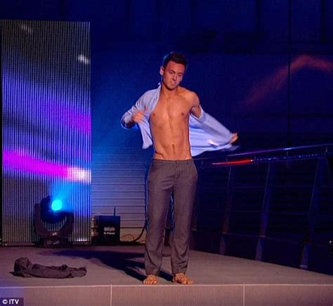 Tom Daley Performs A Sizzling Business Suit To Bathing Suit Strip