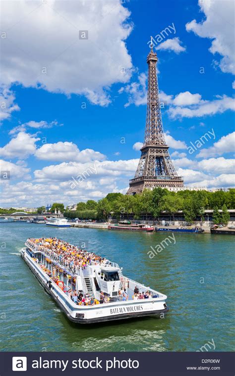 Bateaux Mouches Tour Boat On River Seine Passing The Eiffel Tower