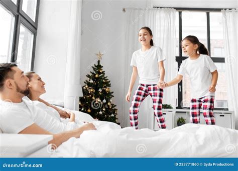 Happy Children Wake Their Parents On Christmas Stock Photo Image Of