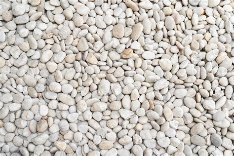 White Pebble Stone Texture On The Ground The Pebbles Closely Stone