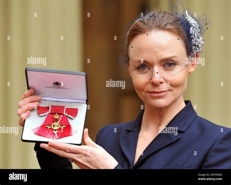 Fashion Designer Stella Mccartney Holds Her Officer Of The British