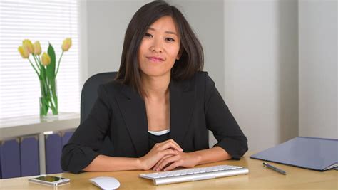 Chinese Businesswoman Listening To Partner Speaking Stock Footage Video