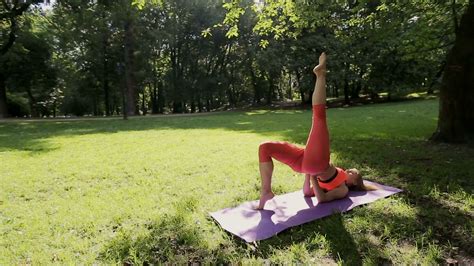 Pretty Girl Doing Yoga And Pilates In The Park In The Sunny Morning