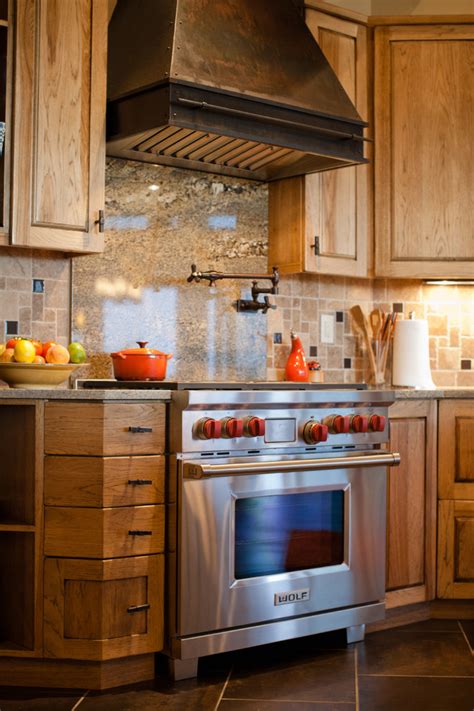 If you have cabinets or other installations over your range hood stove, then you want a unit that won't require too much remodeling. Range Hoods | Traditional - Rustic - Kitchen - Denver - by ...