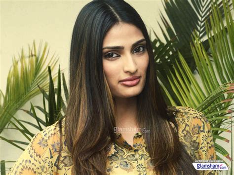 Athiya is wearing harem pants and a tank top in the image while rahul is casually dressed. Athiya Shetty Photos(image), Age, Height, Boyfriend ...