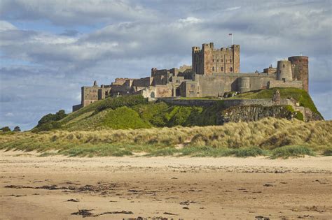 Bamburgh Castle And Its Beach At Bamburgh Near Seahouses