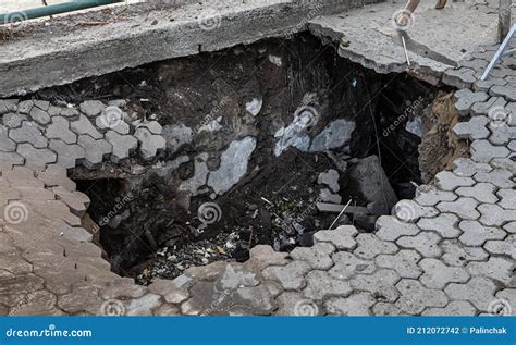 Deep Hole In Pedestrian Sidewalk Area Stock Photo Image Of Incident