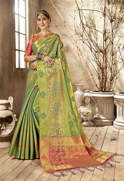 A Woman In A Green And Yellow Sari