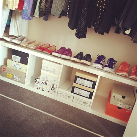 On the top or on the bottom layer of closet shelf. Shoe storage using IKEA Kallax inside the bottom of the ...