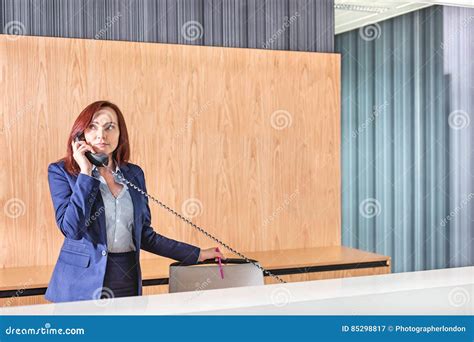 Receptionist Talking On Telephone In Office Stock Image Image Of
