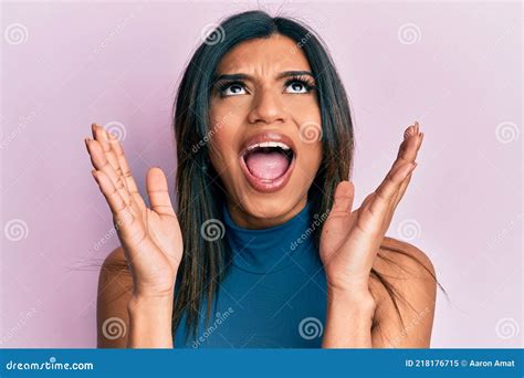 Young Latin Transsexual Transgender Woman With Hands Over Face Angry