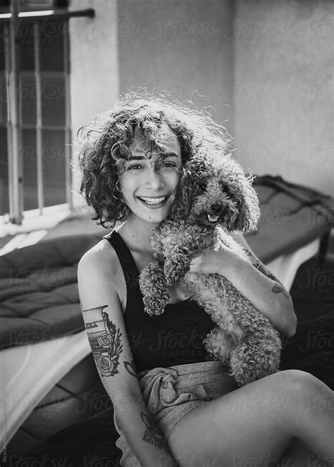 Woman With His Adorable Caniche Puppy By Stocksy Contributor Vera