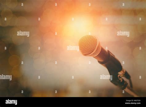 Microphone And Bokeh Background Concept As Music Instrument In Studio