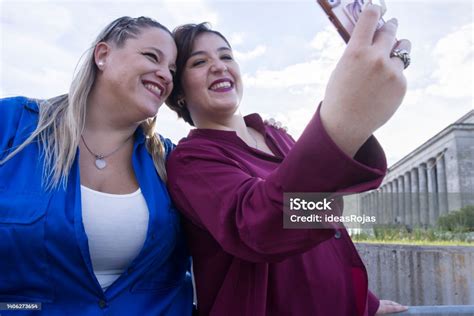 Portrait Of A Chubby Lesbian Couple Smiling For A Selfie Together