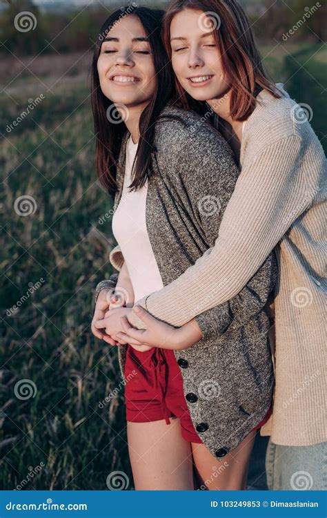 Two Girls Hugging Outdoors Stock Image Image Of Beautiful