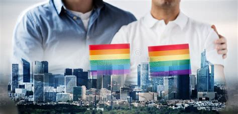 close up of male gay couple holding rainbow flags stock image image of friends flags 52410723