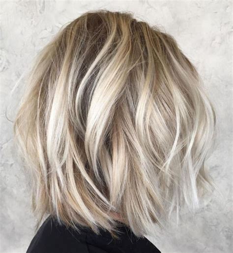Messy Long Blonde Bob With Sliced Ends Curled Bob Hairstyle Edgy Bob Hairstyles Long Layered