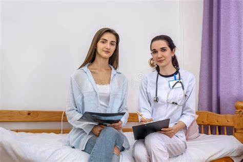Medical Concept Doctor And Patient In Hospital Posing For Camera Stock