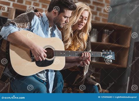 Young Couple Playing Guitar And Singing Together Stock Image Image Of