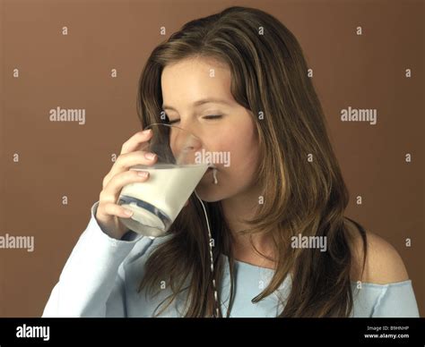 teenagers girl glass milk drink spills portrait at the side series people youth teenagers 14