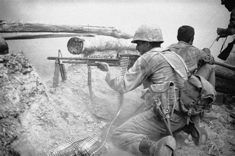 A Us Soldier Of The 25th Infantry Division Fires His Machine Gun At