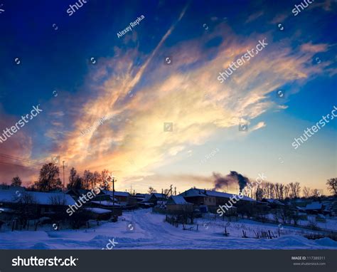 Winter Landscape At Sunset Sunrise Dramatic Sky Village