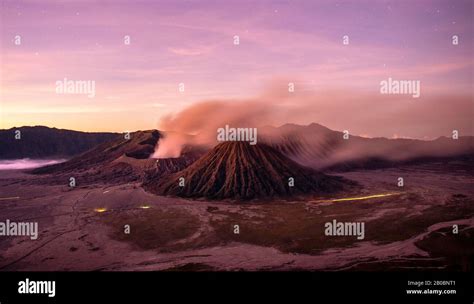 Volcanic Landscape At Sunrise With Starry Sky Smoking Volcano Gunung