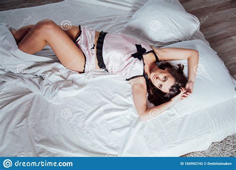 Girl In Pink Pajamas Lying On Bed Stock Photo Image Of Cute Pastel