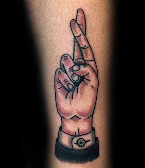Little black ink arrow tattoo on finger. 50 Fingers Crossed Tattoo Designs For Men - Hand Gesture ...
